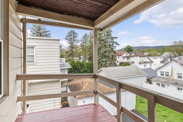 wooden deck featuring a residential view