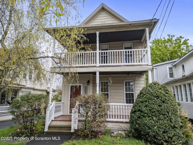 view of front of house featuring a porch and a balcony