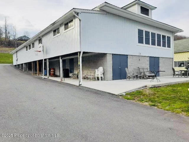13 Hillside St Unit L 25, Nicholson, PA 18446 - rear view of property featuring a patio area