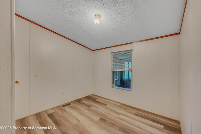 13 Hillside St Unit L 25, Nicholson, PA 18446 - empty room with crown molding, wood finished floors, and a textured ceiling