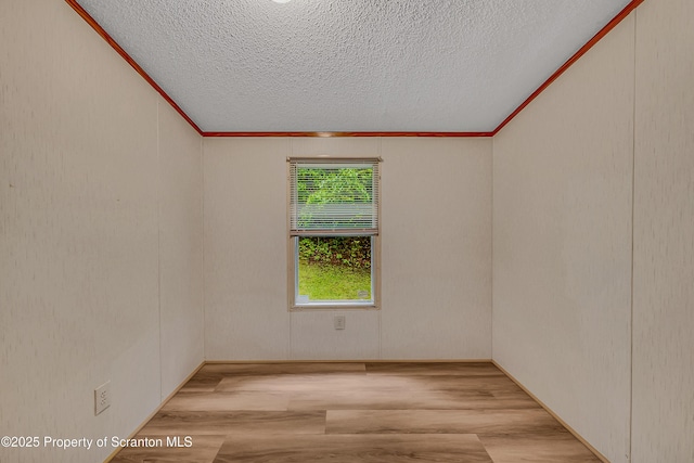 13 Hillside St Unit L 25, Nicholson, PA 18446 - spare room with crown molding, wood finished floors, and a textured ceiling