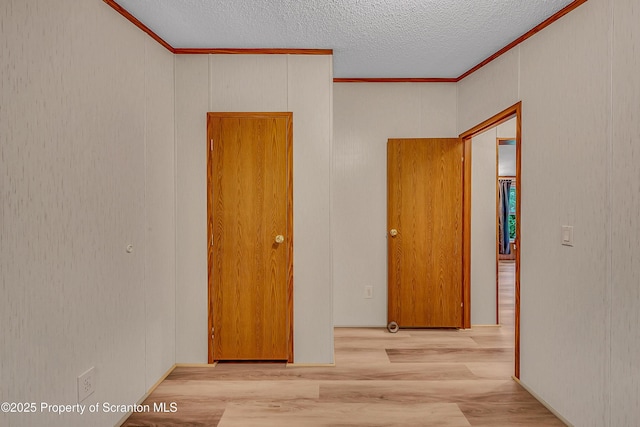 13 Hillside St Unit L 25, Nicholson, PA 18446 - empty room with crown molding, wood finished floors, and a textured ceiling