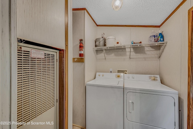 13 Hillside St Unit L 25, Nicholson, PA 18446 - laundry room with washing machine and dryer, a heating unit, crown molding, and a textured ceiling