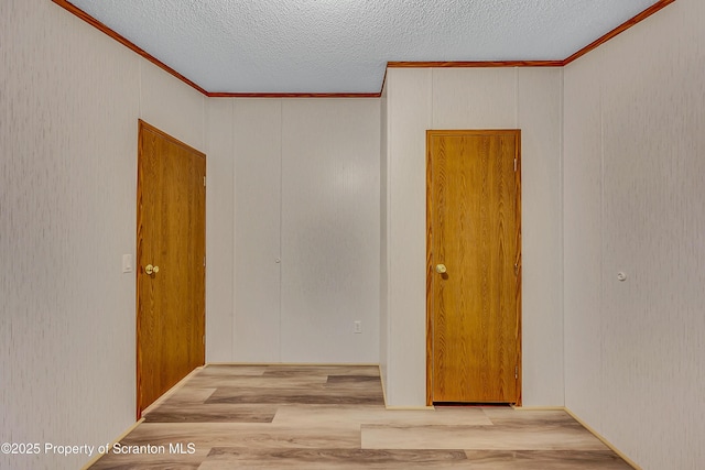 13 Hillside St Unit L 25, Nicholson, PA 18446 - empty room featuring crown molding, wood finished floors, and a textured ceiling