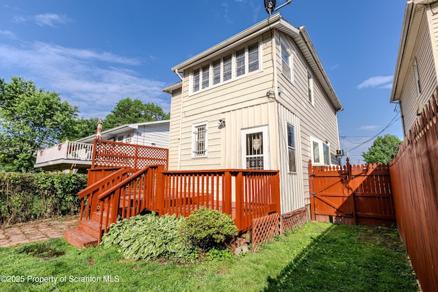 15 Leonard St, Wilkes-Barre, PA 18702 - back of property with a fenced backyard and a wooden deck