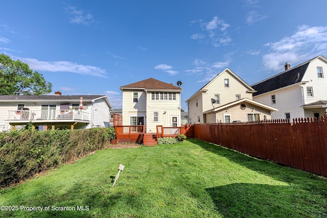 15 Leonard St, Wilkes-Barre, PA 18702 - rear view of property featuring a fenced backyard and a wooden deck