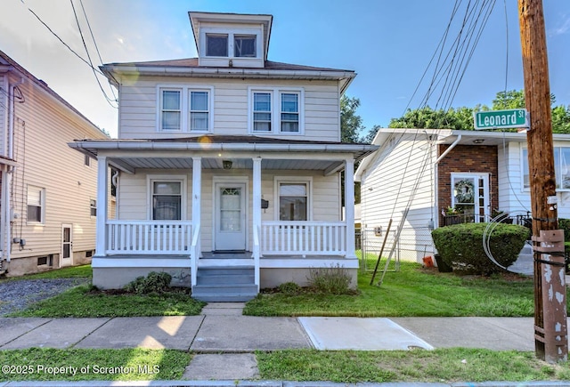 15 Leonard St, Wilkes-Barre, PA 18702 - traditional style home featuring covered porch and a front lawn