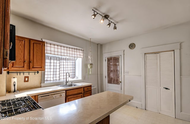15 Leonard St, Wilkes-Barre, PA 18702 - kitchen featuring white dishwasher, brown cabinets, light floors, a peninsula, and light countertops