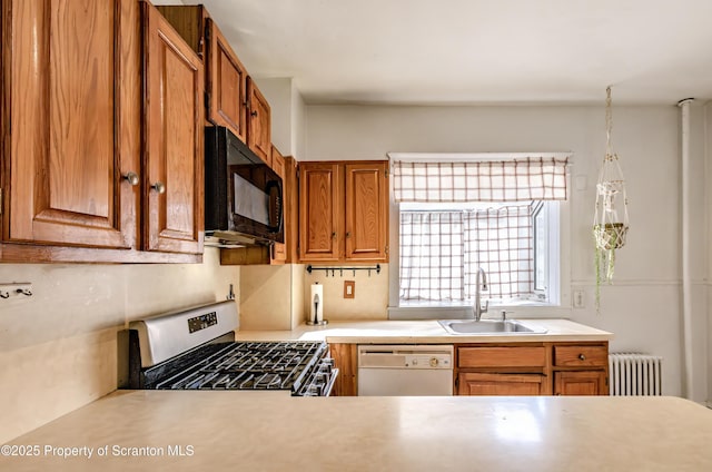 15 Leonard St, Wilkes-Barre, PA 18702 - kitchen featuring black microwave, white dishwasher, stainless steel gas range, light countertops, and radiator heating unit