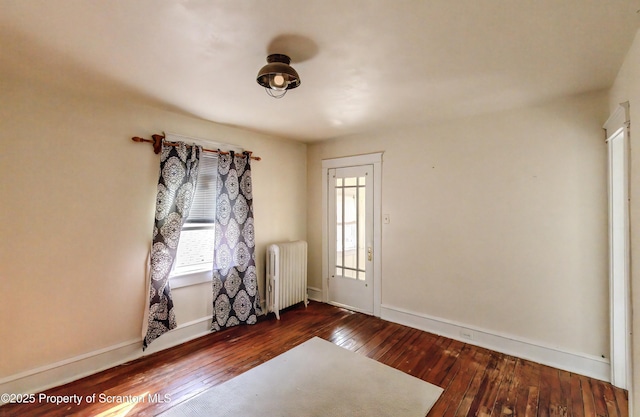 15 Leonard St, Wilkes-Barre, PA 18702 - unfurnished room featuring radiator and hardwood / wood-style flooring