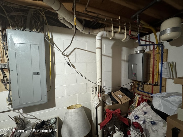 utility room featuring electric panel and water heater