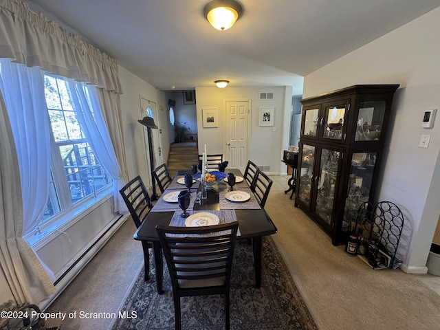 view of carpeted dining area