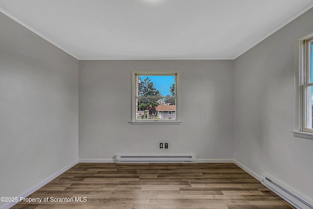 633 Connell St, Scranton, PA 18505 - unfurnished room with baseboard heating, crown molding, and wood finished floors