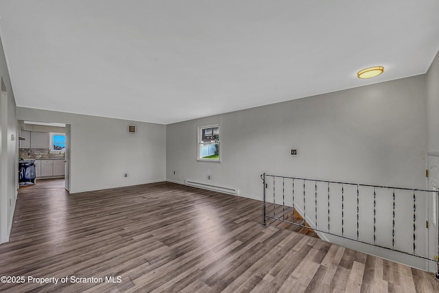 633 Connell St, Scranton, PA 18505 - unfurnished living room featuring a baseboard radiator and wood finished floors