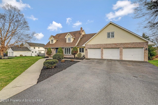 cape cod-style house with driveway, brick siding, and a front lawn