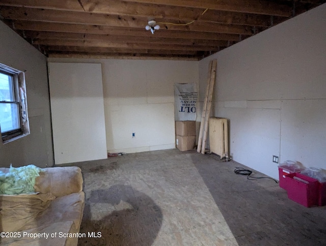 basement featuring radiator heating unit