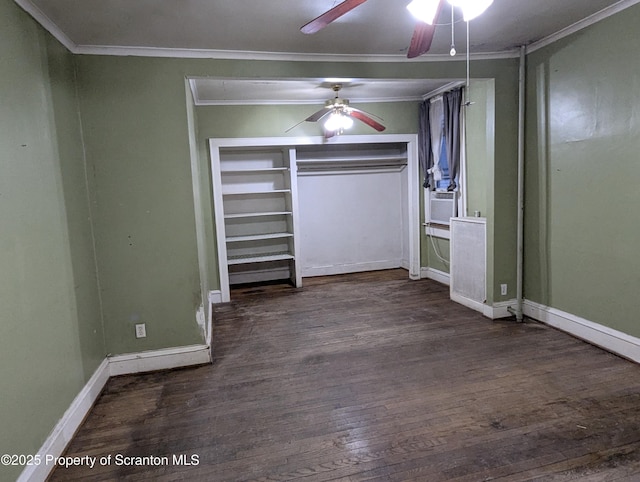 unfurnished bedroom featuring ornamental molding, dark wood-type flooring, ceiling fan, and a closet