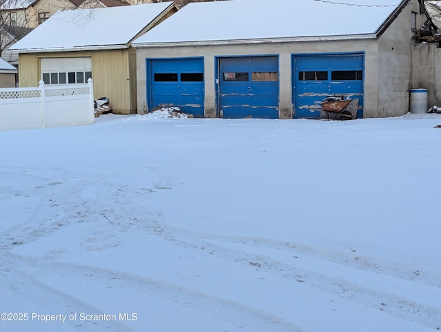 view of snow covered garage