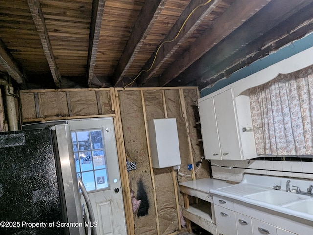 interior space featuring sink and backsplash