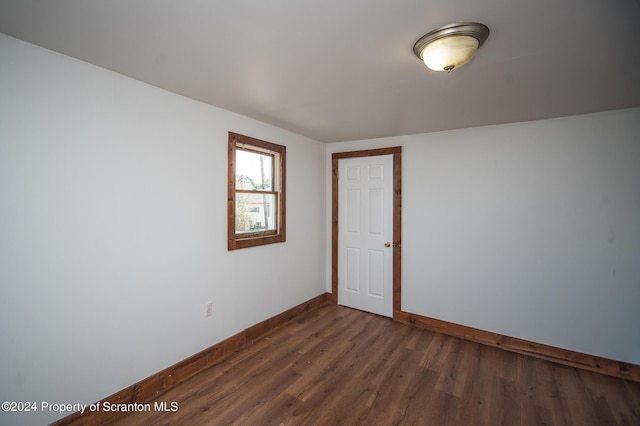 empty room featuring dark hardwood / wood-style floors