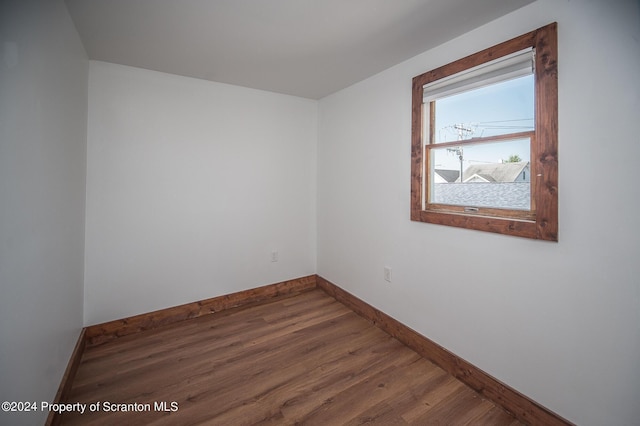 spare room with hardwood / wood-style flooring