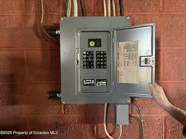 utility room featuring electric panel