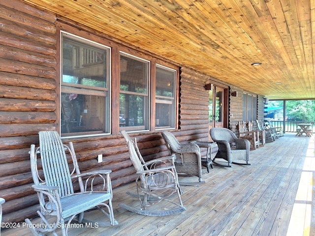 wooden terrace with a porch