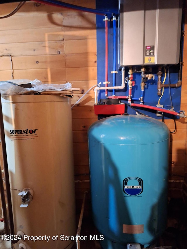 utility room featuring water heater