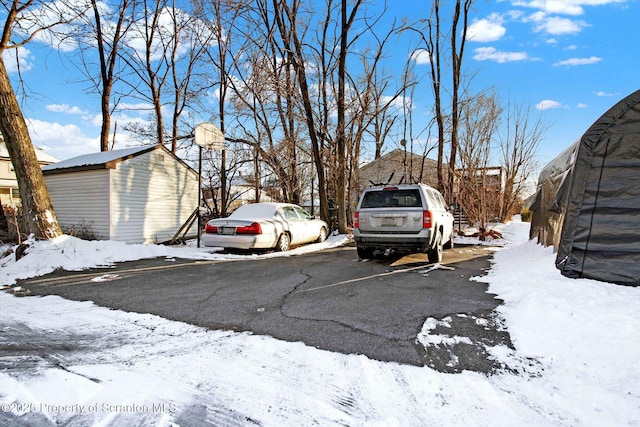 view of snow covered parking