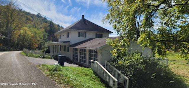 view of side of property featuring a mountain view