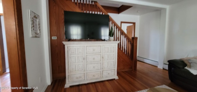 living room with wood-type flooring and a baseboard radiator