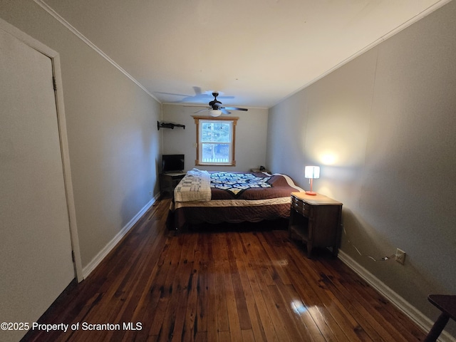 bedroom with ceiling fan, dark hardwood / wood-style flooring, and ornamental molding