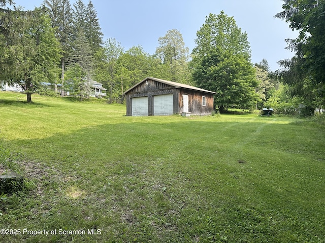 439 Old Union Rd, Equinunk, PA 18417 - view of green lawn featuring a garage and an outbuilding