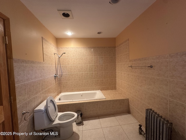 439 Old Union Rd, Equinunk, PA 18417 - bathroom featuring tile walls, radiator heating unit, tile patterned flooring, and tiled shower / bath