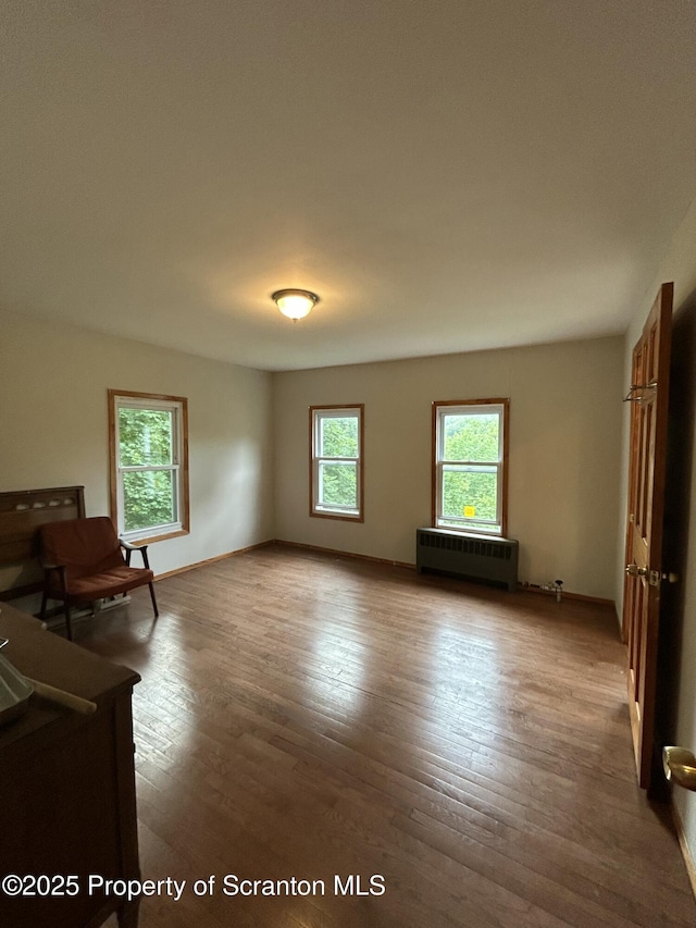 439 Old Union Rd, Equinunk, PA 18417 - unfurnished living room with radiator heating unit and wood-type flooring