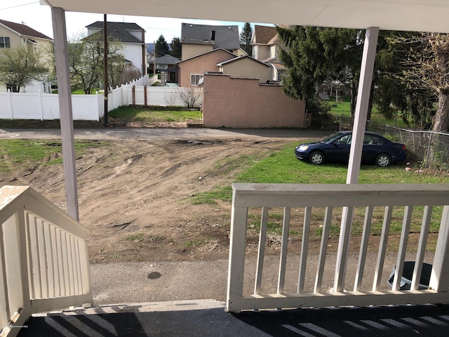 view of yard with a residential view and fence