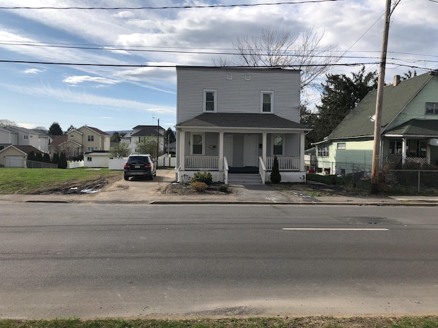 view of front of property featuring a residential view and covered porch