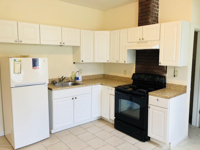 kitchen featuring freestanding refrigerator, white cabinetry, a sink, black range with electric cooktop, and under cabinet range hood