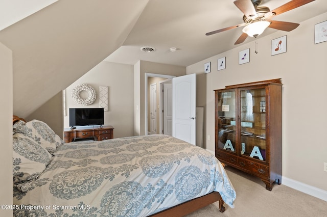 carpeted bedroom with ceiling fan and lofted ceiling