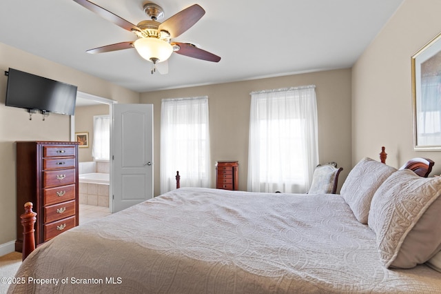 bedroom with ceiling fan and ensuite bathroom