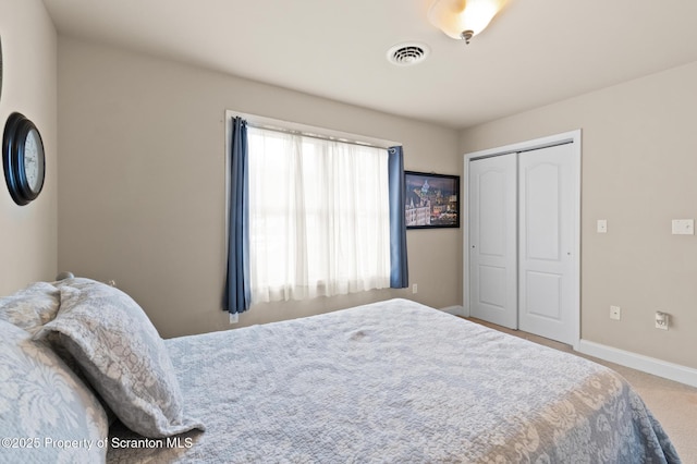 bedroom featuring a closet and carpet flooring