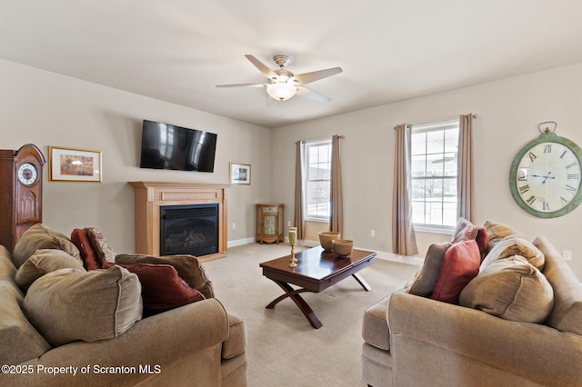 living room featuring ceiling fan and light colored carpet