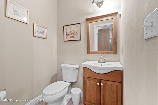 bathroom with toilet and vanity