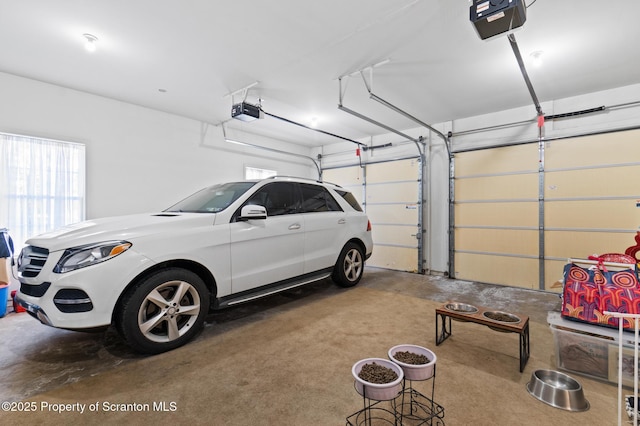 garage featuring a garage door opener