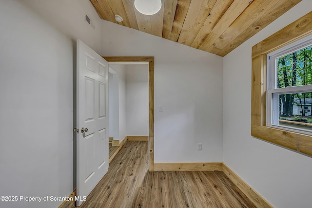28 Holland Rd, Hawley, PA 18428 - empty room with vaulted ceiling, wood finished floors, and a smoke detector