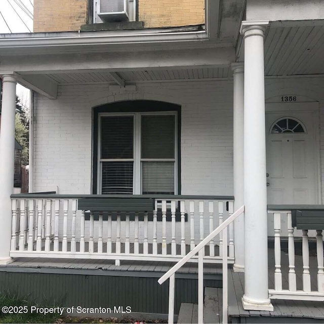 property entrance with covered porch