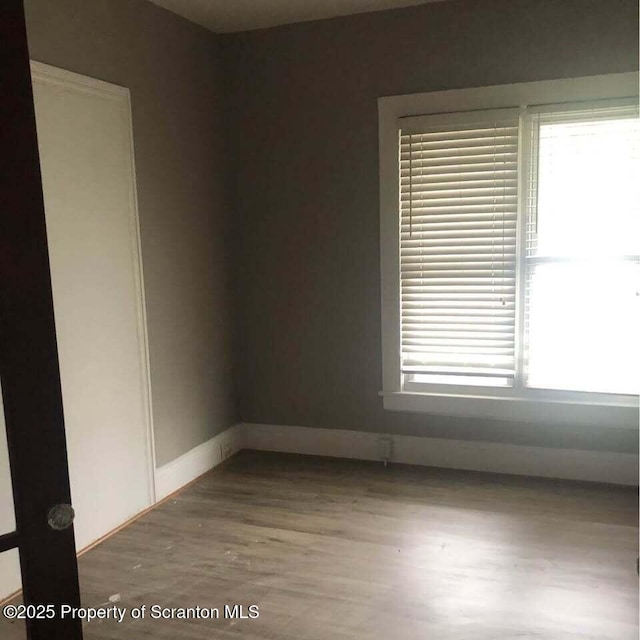 empty room featuring wood-type flooring