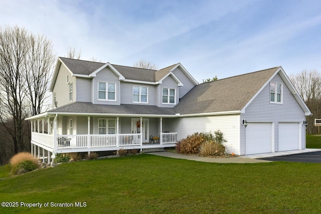 view of front facade featuring driveway, roof with shingles, an attached garage, covered porch, and a front yard