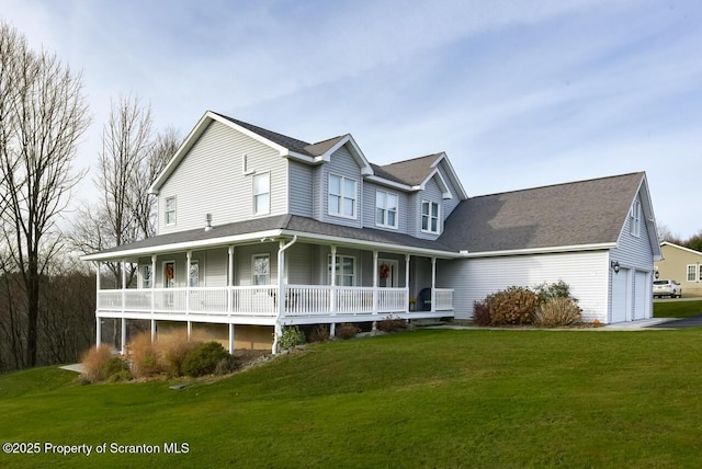 view of front of house with a garage, covered porch, and a front lawn