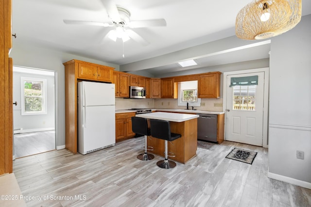 675 Apple Tree Rd, Harding, PA 18643 - kitchen featuring appliances with stainless steel finishes, light countertops, plenty of natural light, and a center island